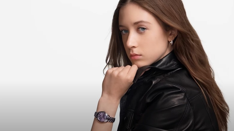 Sunday Rose Kidman-Urban wearing a silver and purple watch and black leather jacket in an Omega ad