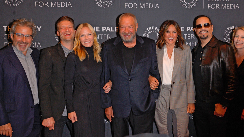 Members of the Law and Order SVU cast smiling 