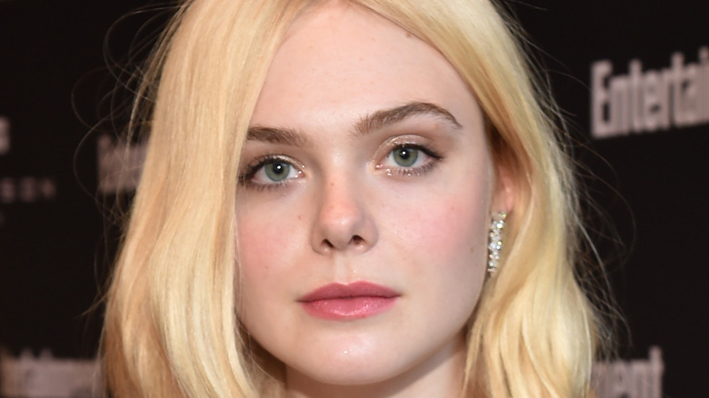 Elle Fanning poses on the red carpet