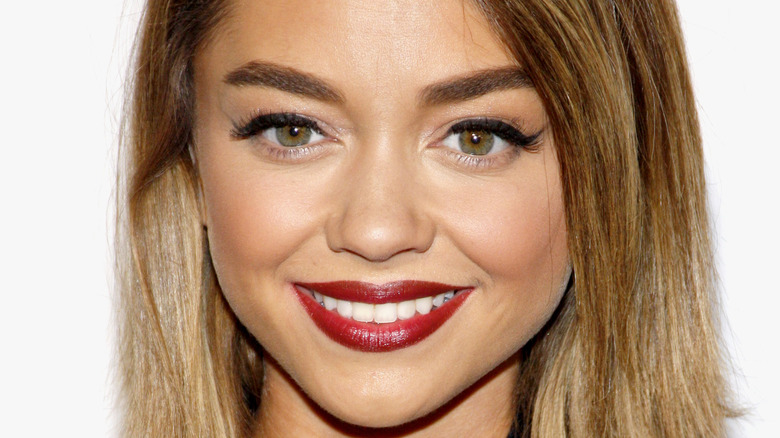 Sarah Hyland smiling on the red carpet