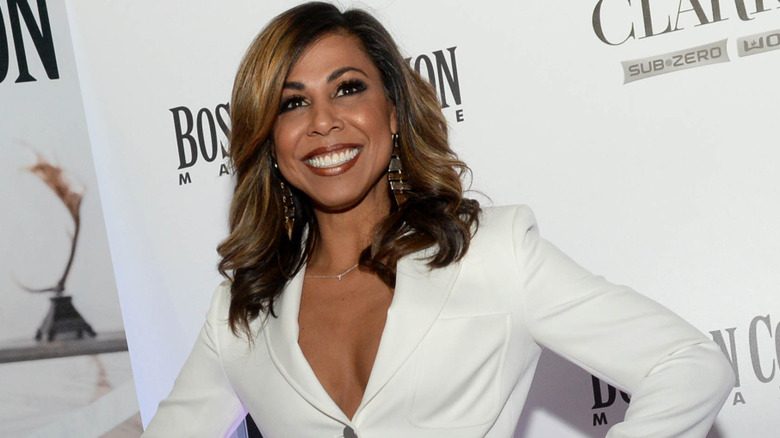 Taniya Nayak smiling with hands on hips