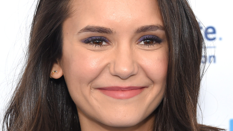 Nina Dobrev smiling on red carpet