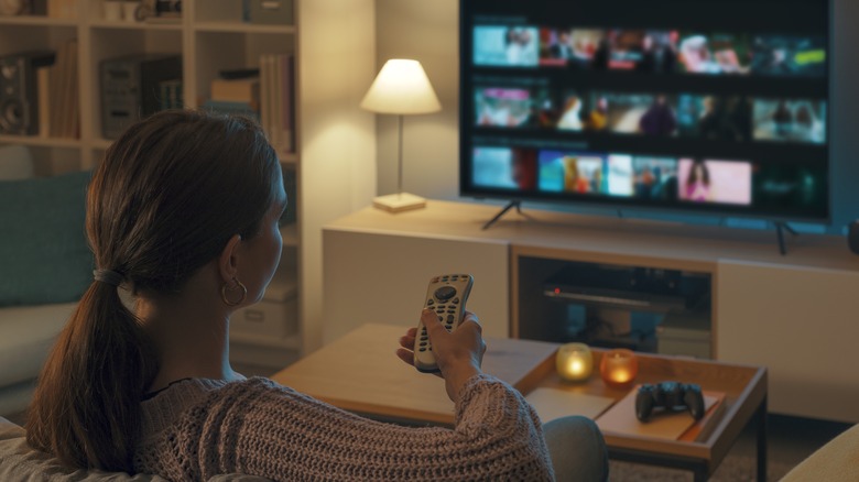 Woman watching movie on couch