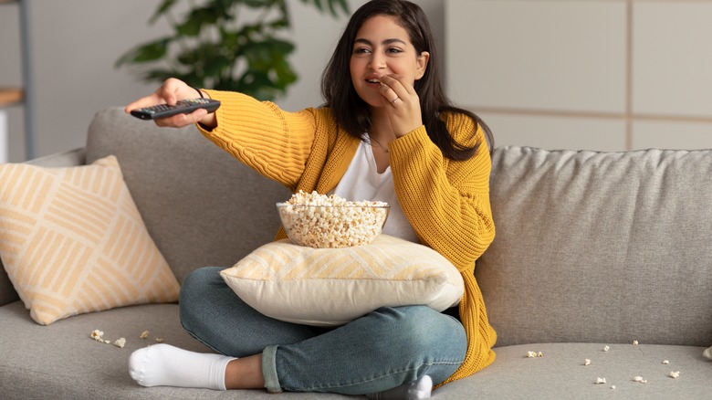 Woman watching movie with popcorn