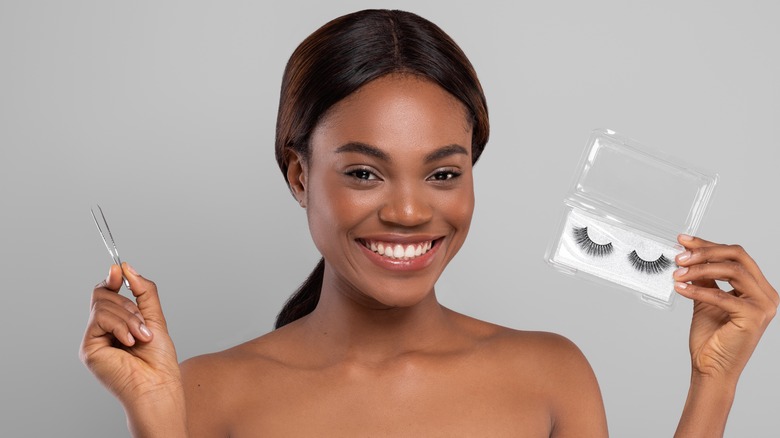 Woman poses with false eyelashes