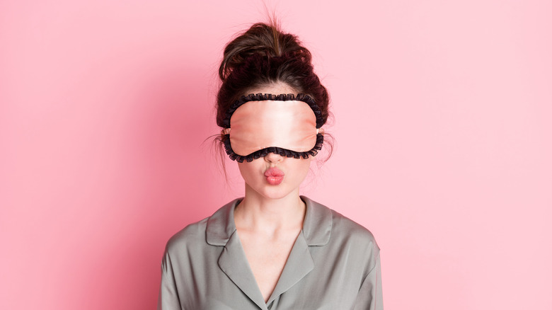 Woman with bun and sleep mask