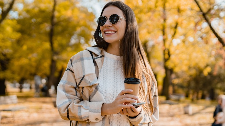 Woman wearing sunglasses in park