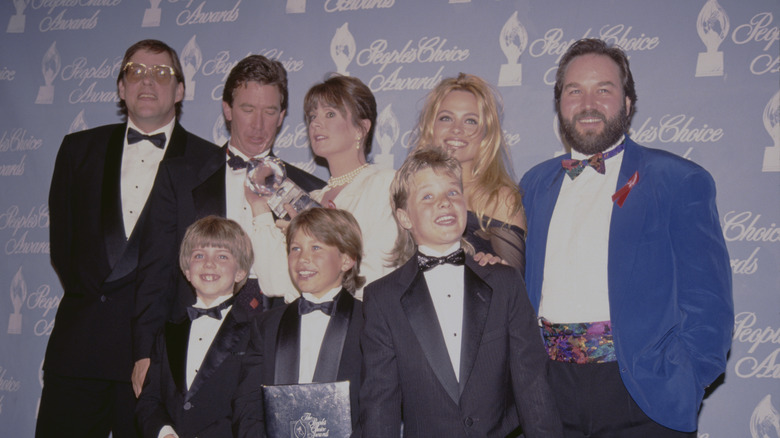 American actor and comedian Blake Clark, American actor and comedian Tim Allen, American actress Patricia Richardson, Canadian actress Pamela Anderson, American actor and comedian Richard Karn, (front) American child actor Taran Noah Smith, American child actor Jonathan Taylor Thomas and American child actor Zachery Ty Bryan attend the 18th Annual People's Choice Awards, held at Universal Studios Hollywood in Universal City, California 17th March 1992.