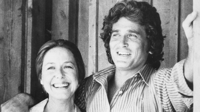 Karen Grassle and Michael Landon smiling on the set of Little House on the Prairie