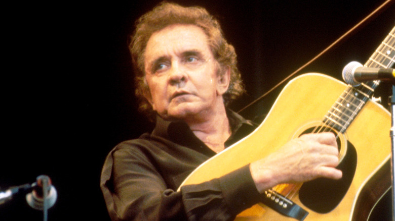 Johnny Cash playing guitar