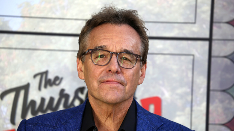 Chris Columbus posing in front of a white background