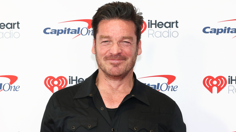 Bart Johnson smiling on red carpet