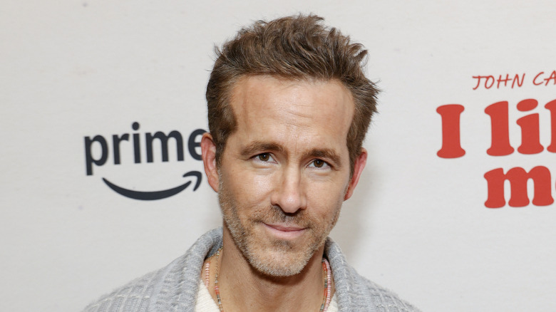 Ryan Reynolds smiles on red carpet