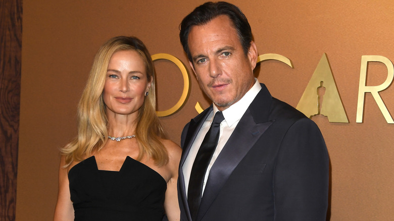 Carolyn Murphy posing with Will Arnett at the Oscars