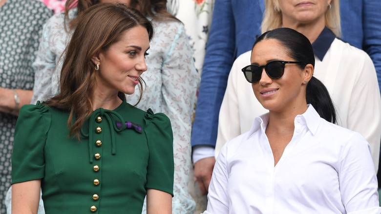 Kate Middleton and Meghan Markle in green and white, respectively