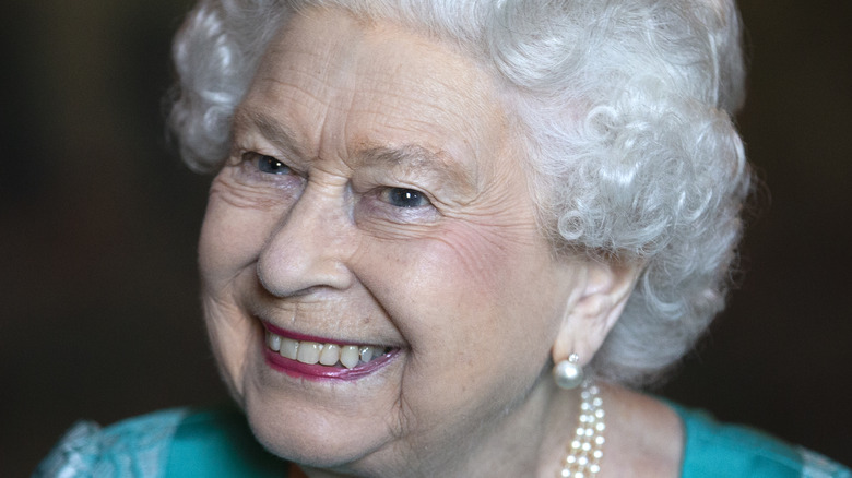 Queen Elizabeth smiling at an event
