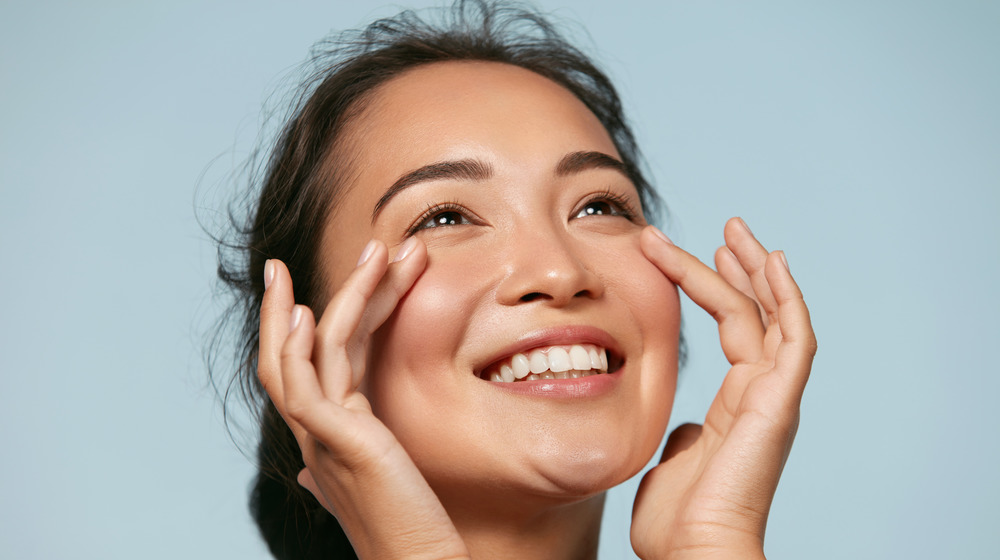 woman showing off glowing complexion