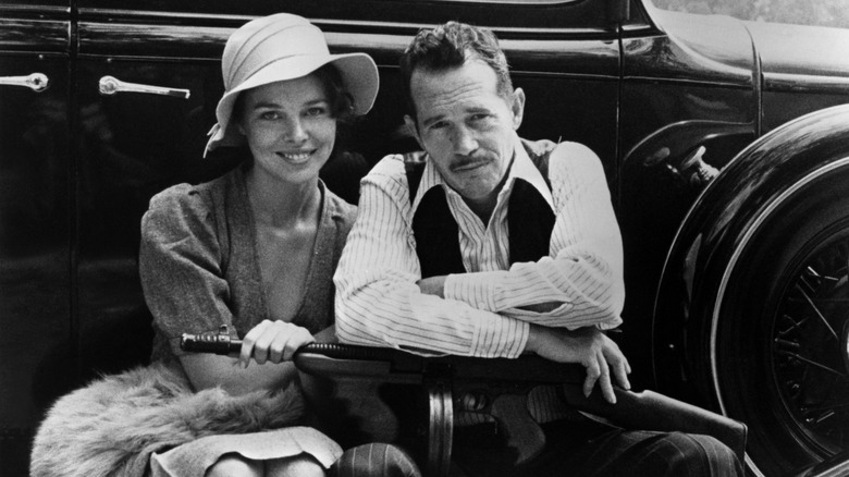 Michelle Phillips and Warren Oates on the set of Dillinger.