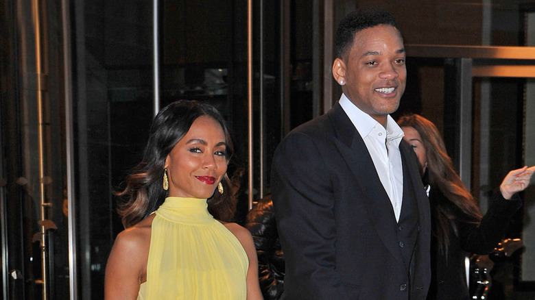 Will Smith and Jada Pinkett Smith walking down the street in 2013.