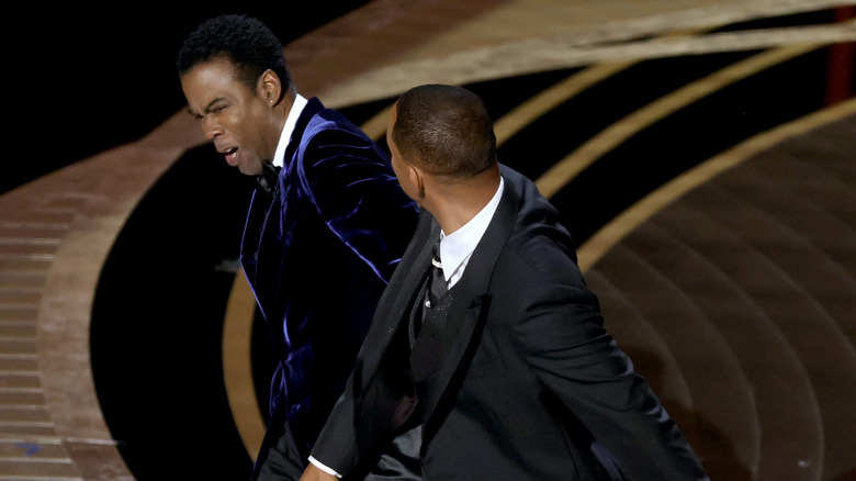 Will Smith slapping Chris Rock in the face onstage at the 94th Academy Awards in 2022.