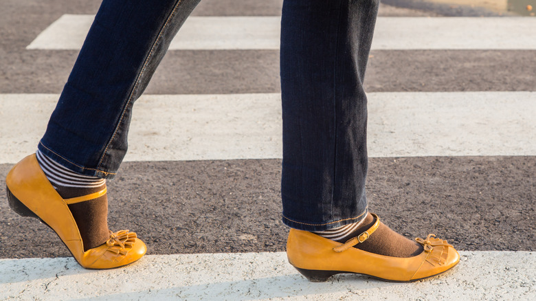 Woman wearing yellow Mary Jane shoes 
