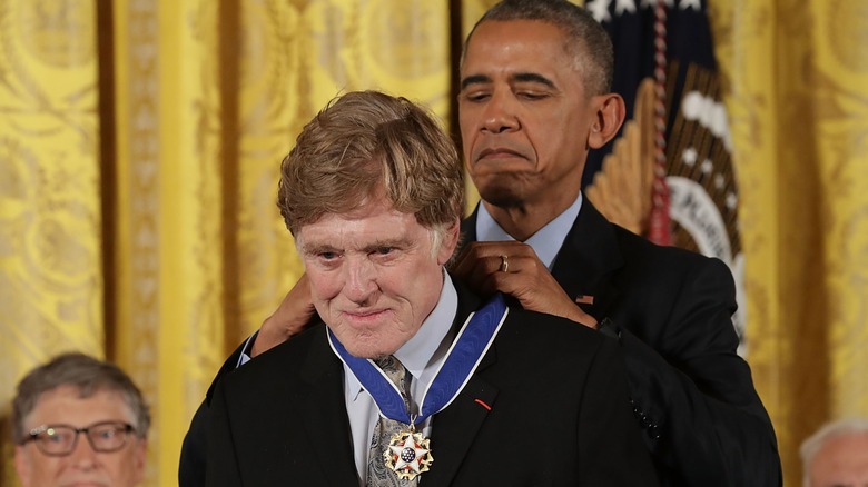 Barack Obama giving Robert Redford the Presidential Medal of Freedom