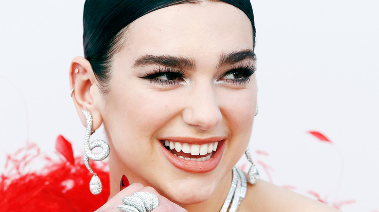 Dua Lipa smiling on red carpet