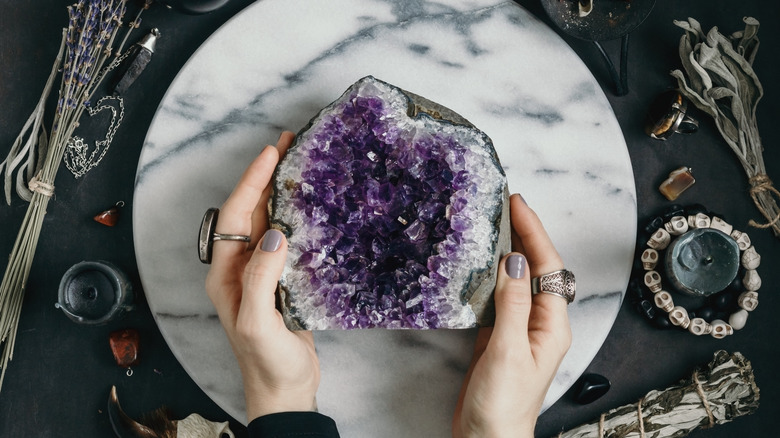 Woman holding amethyst stone