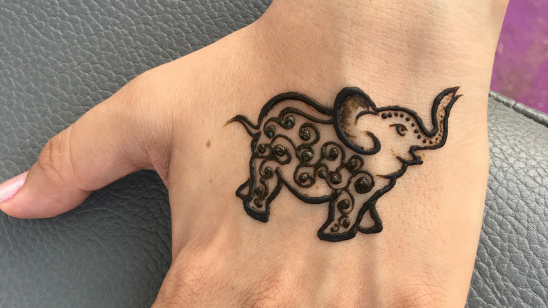 Elephant With Umbrella Henna Tattoo On Hand