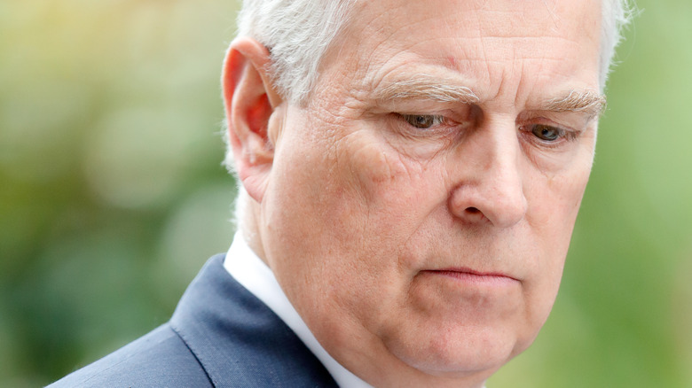 Prince Andrew looking somber