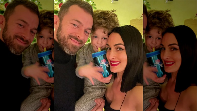 Nikki Garcia and Artem Chigvintsev with their son