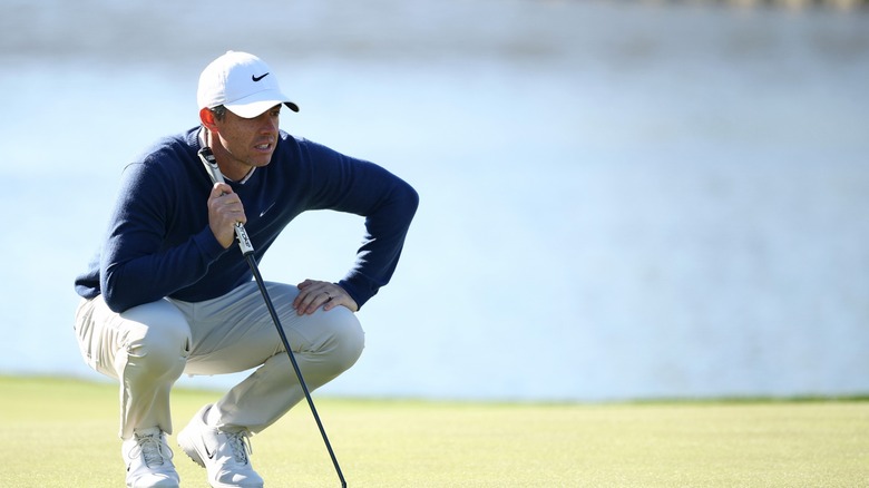 Rory McIlroy lines up a shot at the 2025 Players Championship