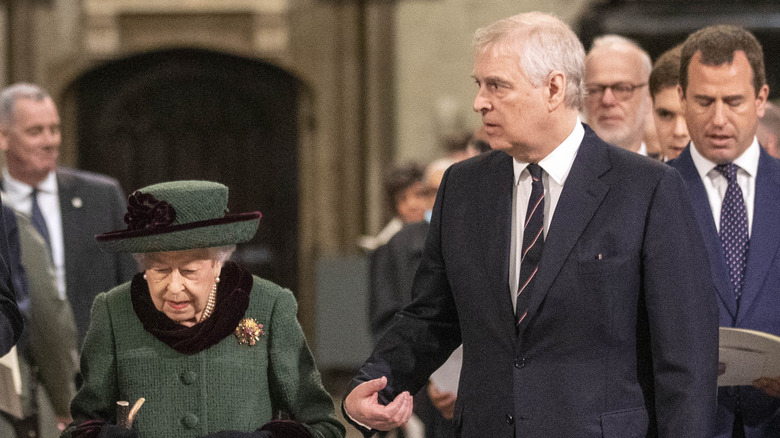 Prince Andrew offers his arm to the queen