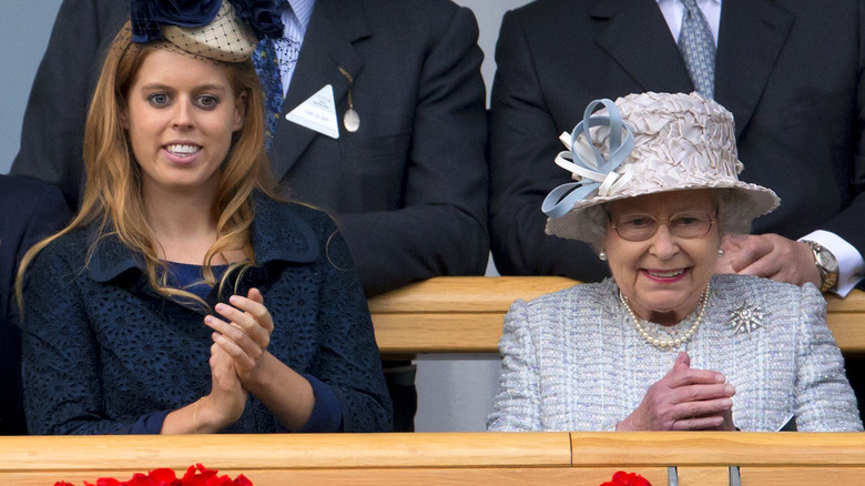 Princess Beatrice and the queen clapping