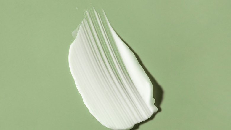 Lotion on green background