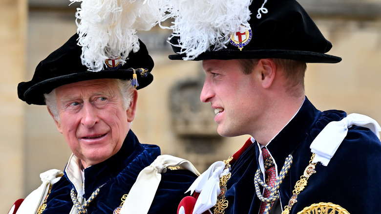 King Charles III looking at Prince William 