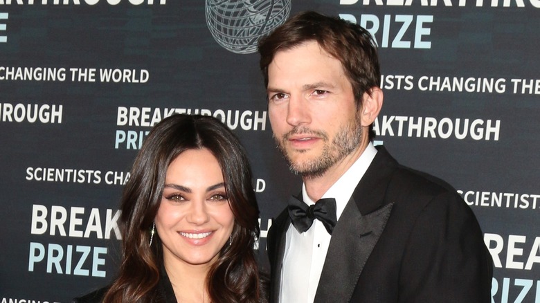 Mila Kunis and Ashton Kutcher posing