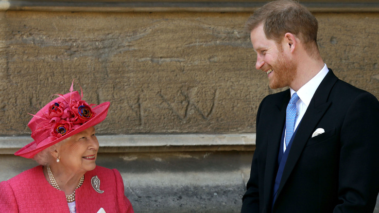 Queen Elizabeth II speaks with Prince Harry, Duke of Sussex as they leave after the wedding of Lady Gabriella Windsor to Thomas Kingston at St George's Chapel, Windsor Castle on May 18, 2019 in Windsor, England (2019)