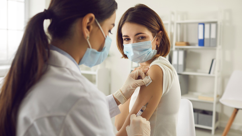 Woman receiving COVID-19 vaccine