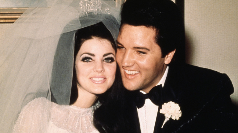 Elvis and Priscilla Presley smiling on their wedding in May 1967