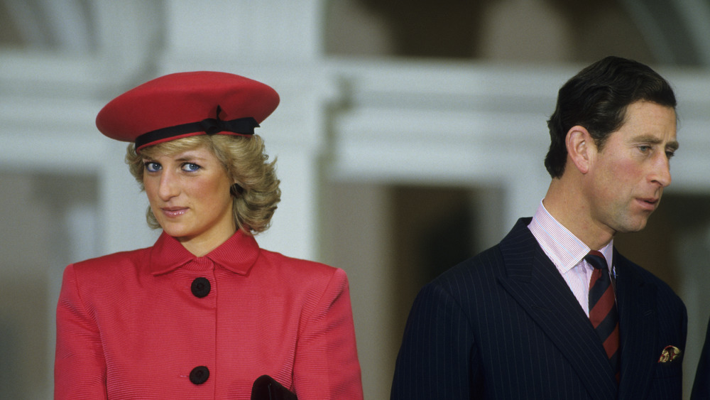 Diana Spencer and Prince Charles turning from each other