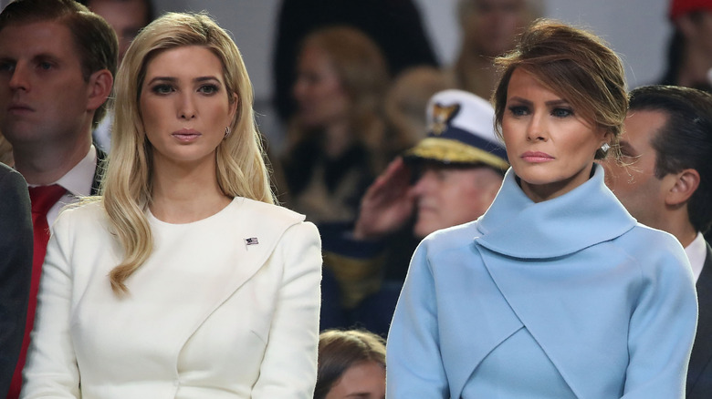 Ivanka Trump and Melania Trump looking grim while standing next to each other