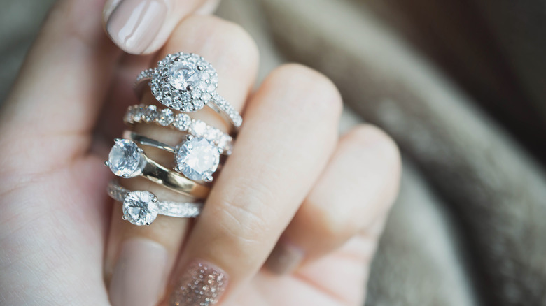 various engagement ring styles on finger