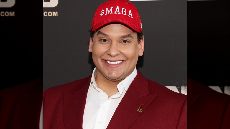 George Santos attending a movie screening wearing a $MAGA hat