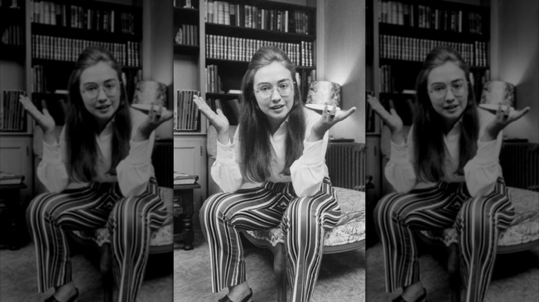 Hillary Clinton as a student in 1969 wearing striped trousers in a black and white photograph