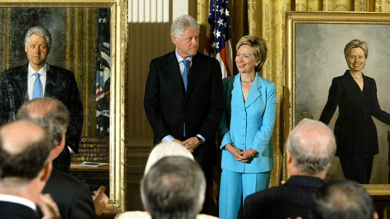 Bill and Hillary Clinton attend the unveiling of their portraits in the East Room of the White House in June 2004