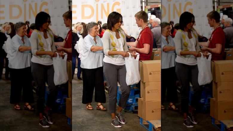 Michelle Obama attenting a food bank event in Washington DC, filling up plastic bags