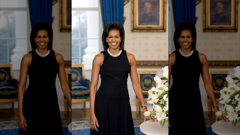 First Lady Michelle Obama poses for an official White House photo wearing a sleeveless dress in 2008