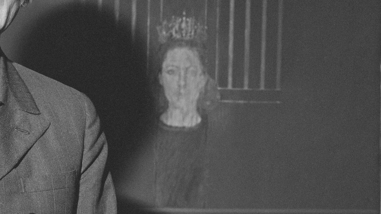 A portrait of Princess Margaret with a stern face in black and white