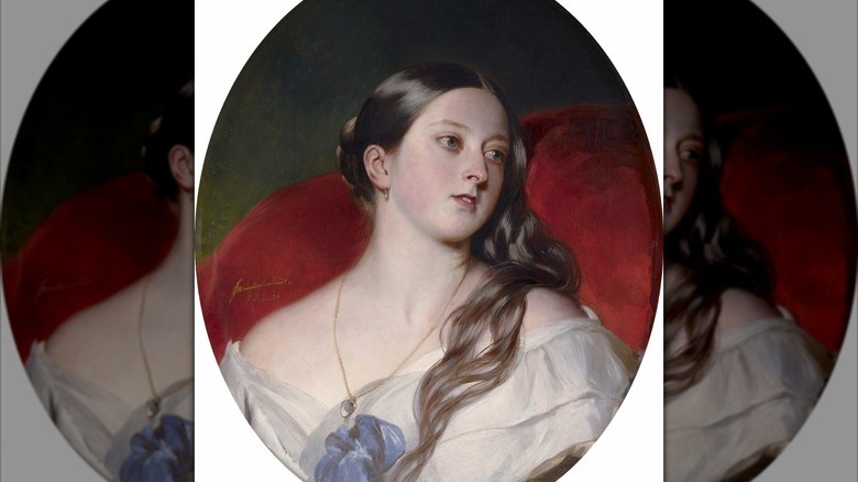 A portrait of Queen Victoria wearing a white top